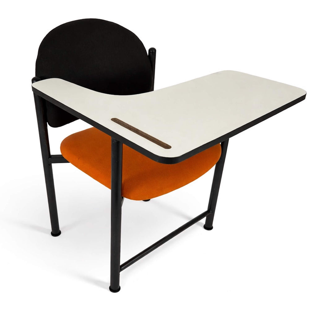 Learning Chair with black backrest and orange seat with a writing desk on a white background